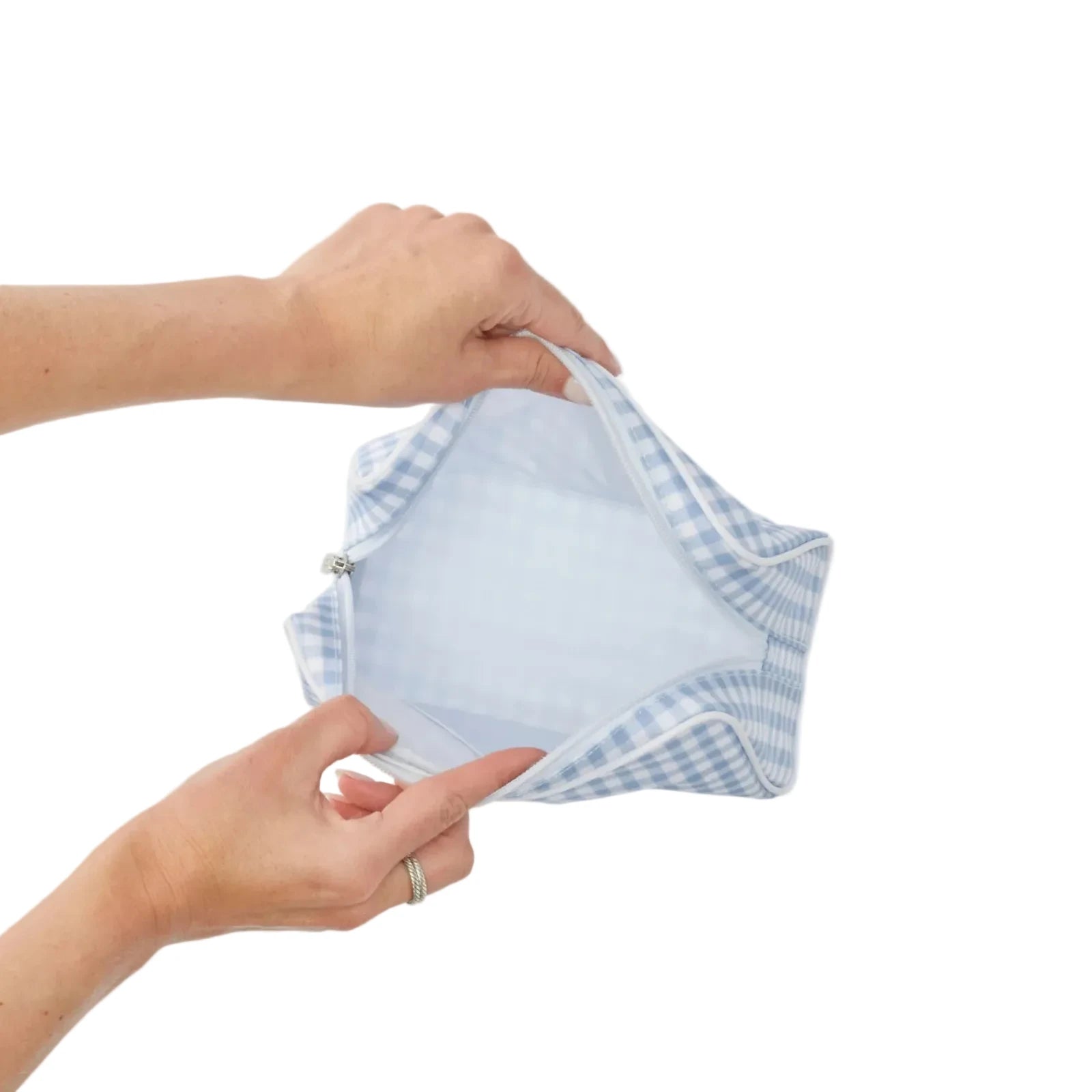 Inside of the blue gingham toiletry bag with zipper on white background 