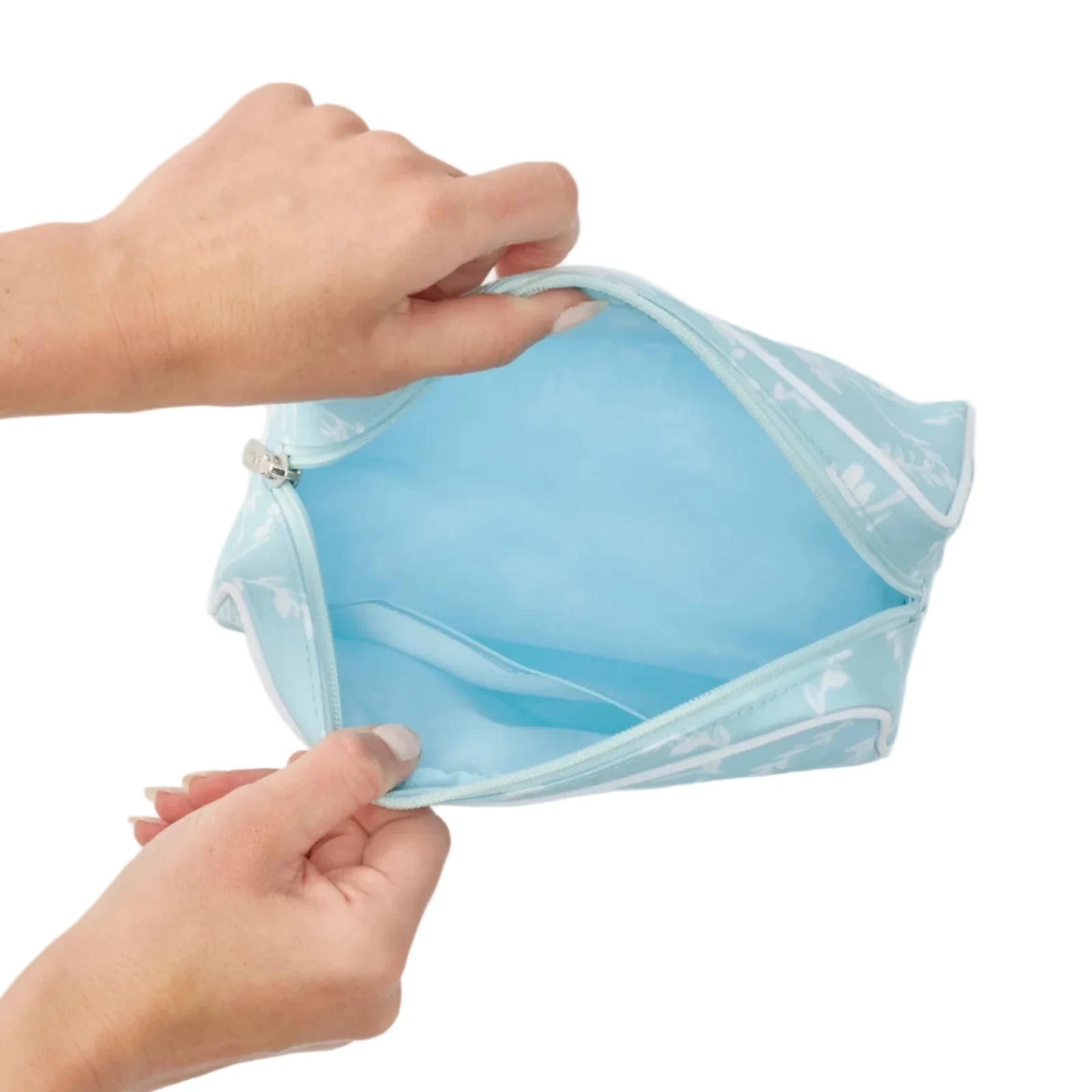 Inside of blue trellis toiletry bag with zipper 