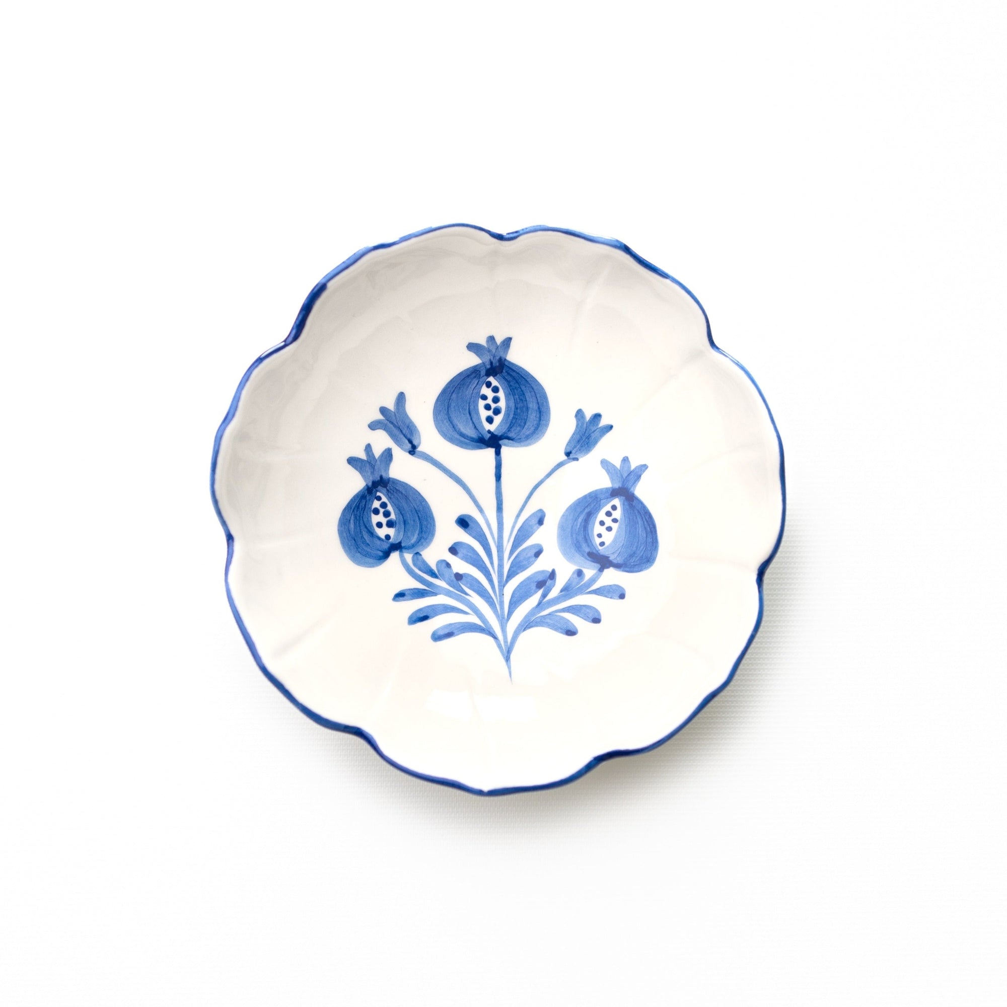 Decorative plate with blue floral design on a white background