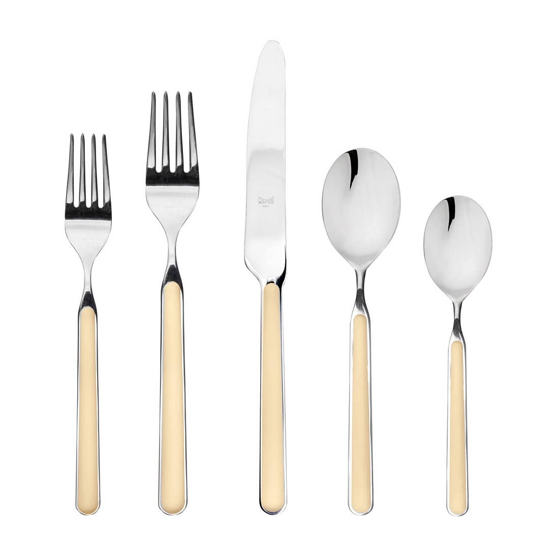 Five piece Italian flatware set in vanilla with 2 forks, knife and 2 spoons on white background 