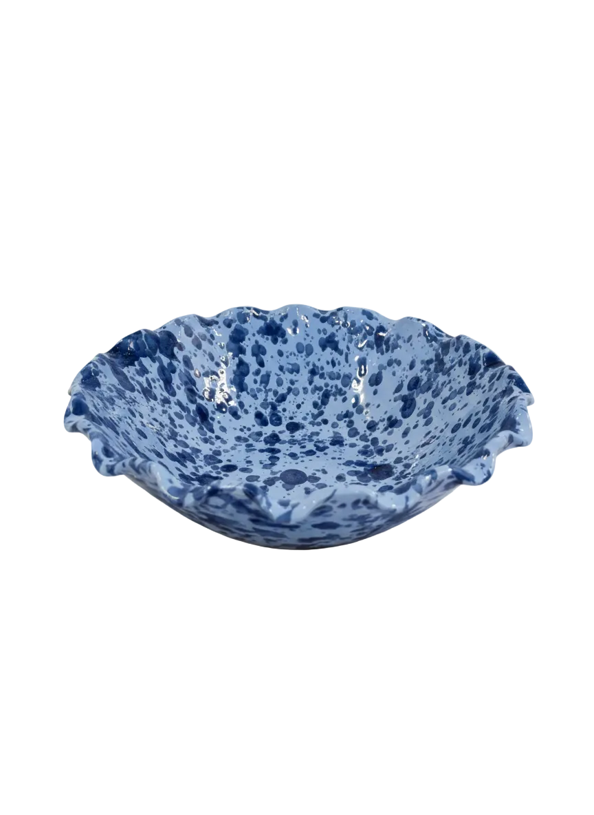Blue ceramic bowl with a speckled pattern on a white background