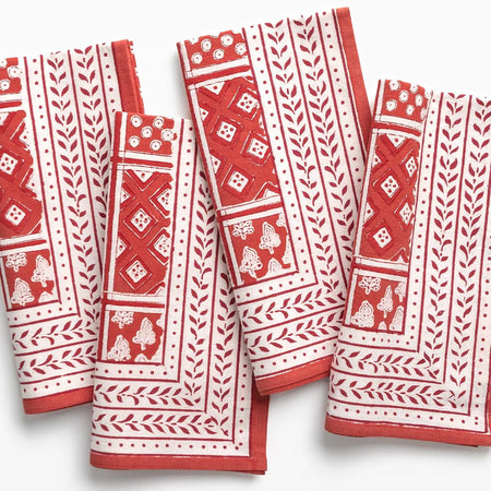 Set of red and white patterned napkins on a white background