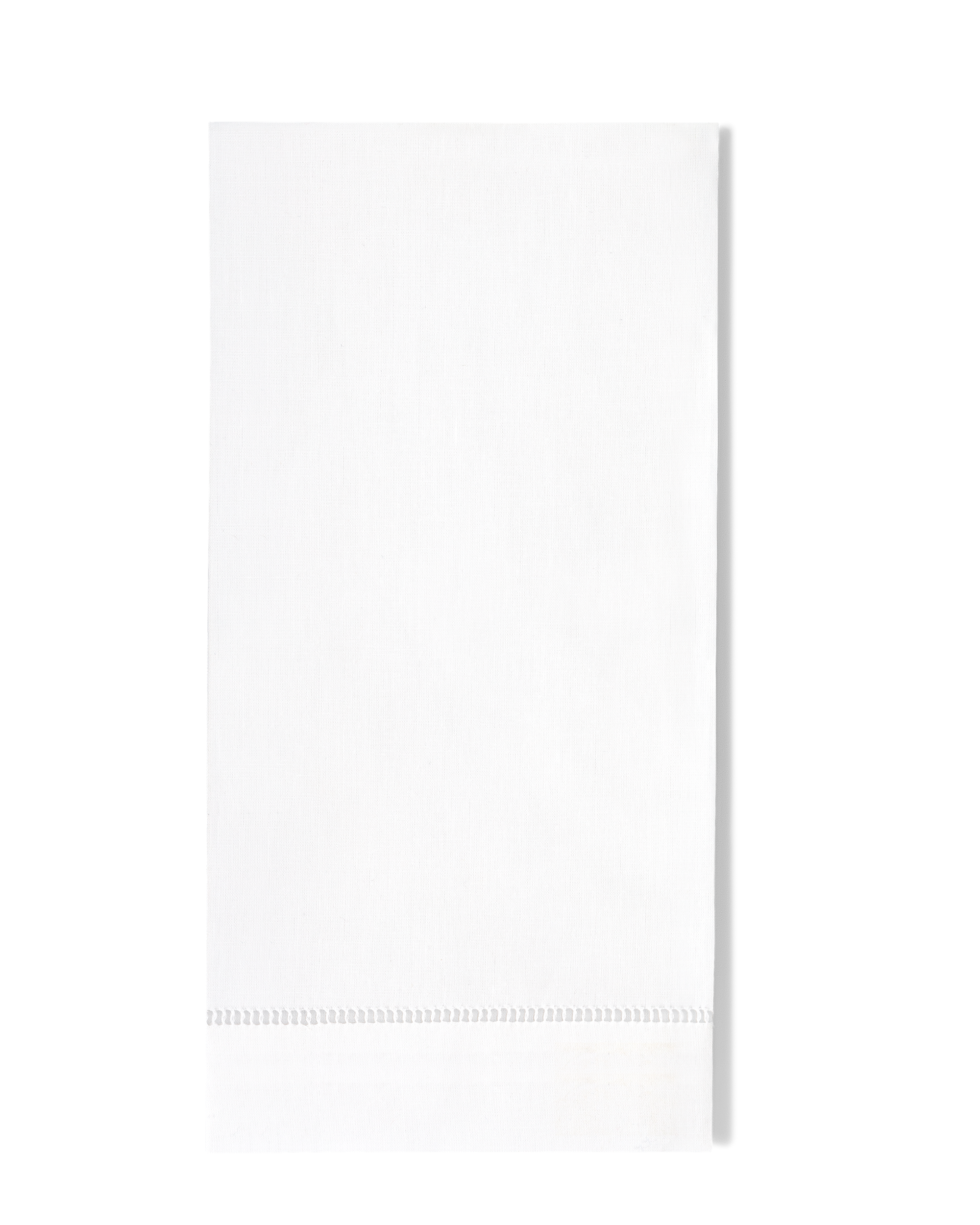 White tea towel with embroidered design at bottom on grey and black check background 