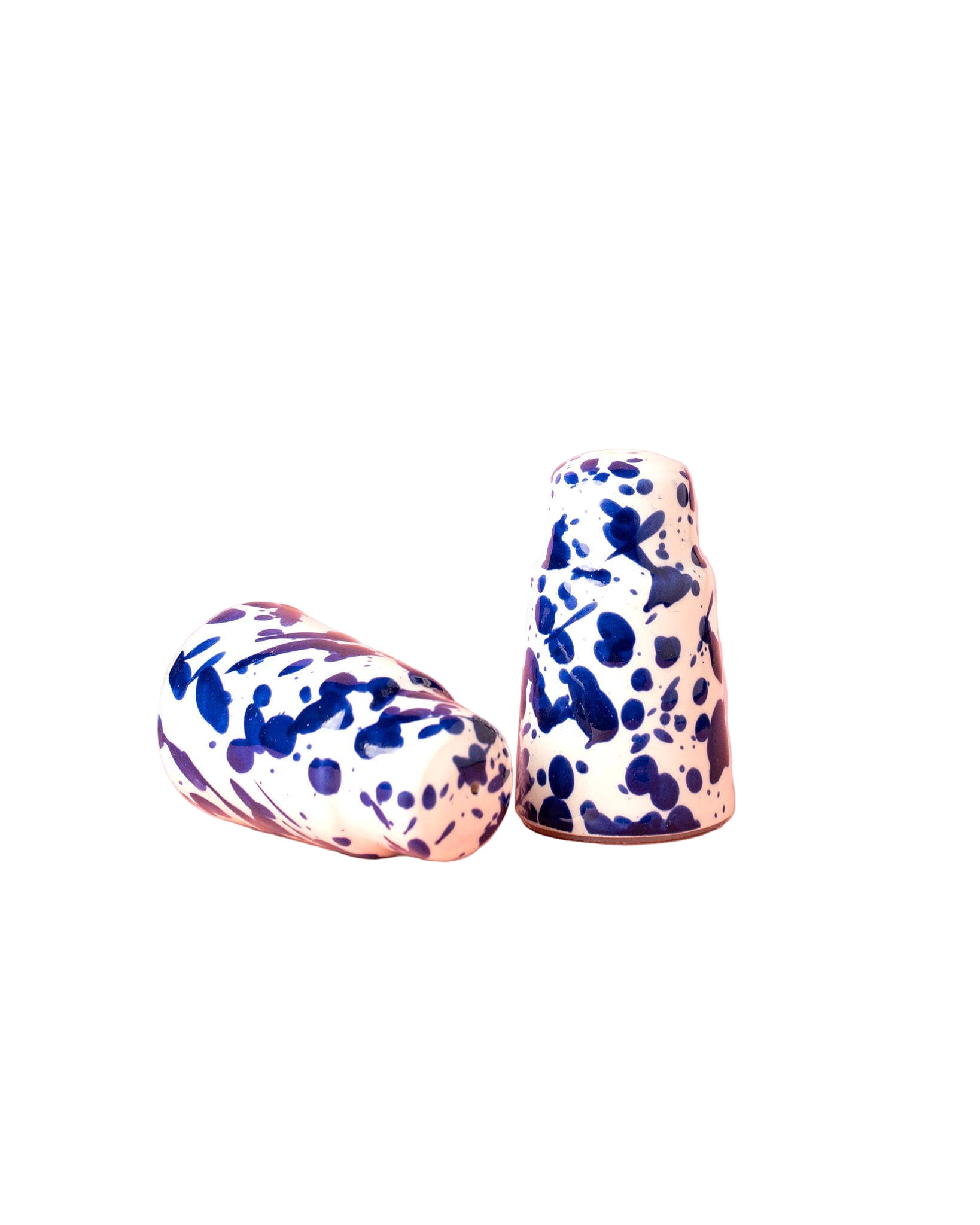 Two ceramic salt and pepper shakers with blue splatter design 