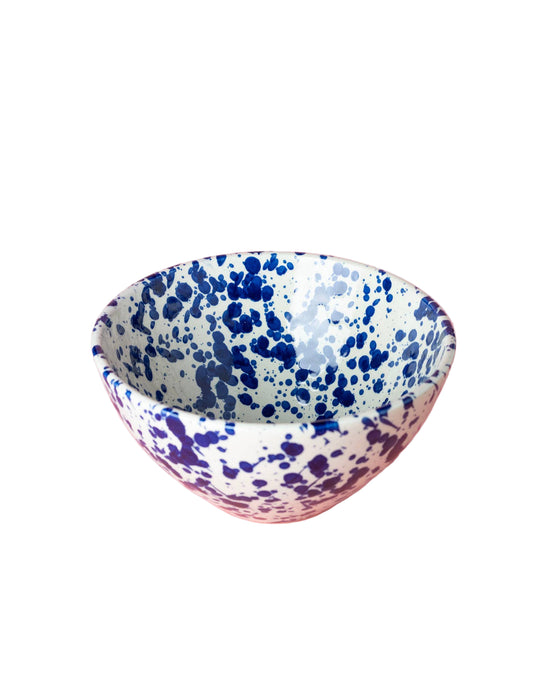 Speckled blue and white bowl on a white background