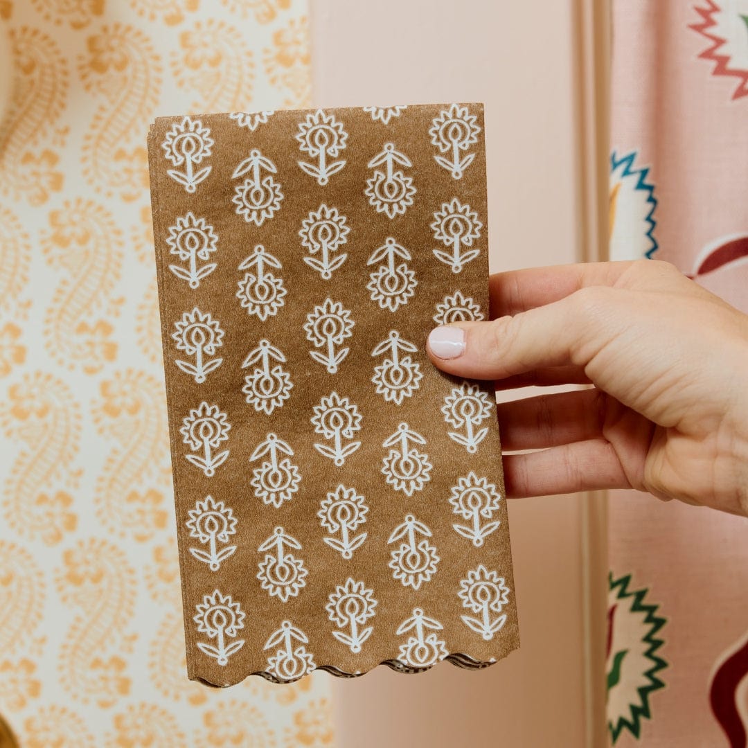Brown tullie paper napkin with decorative background