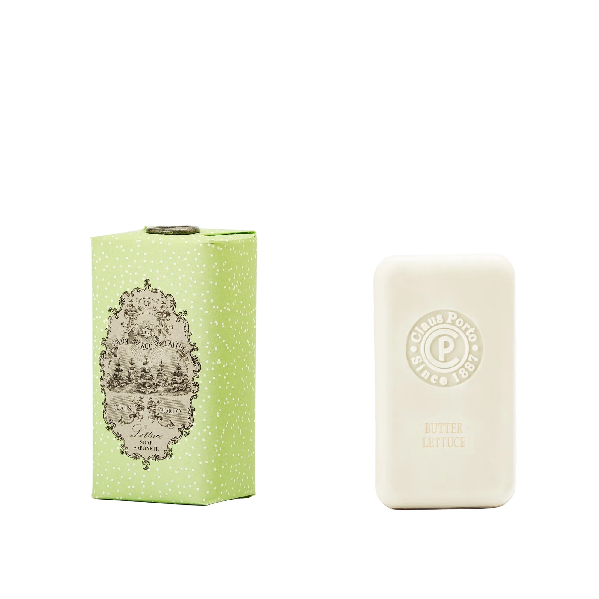 Green box and white bar of soap with branding on a white background