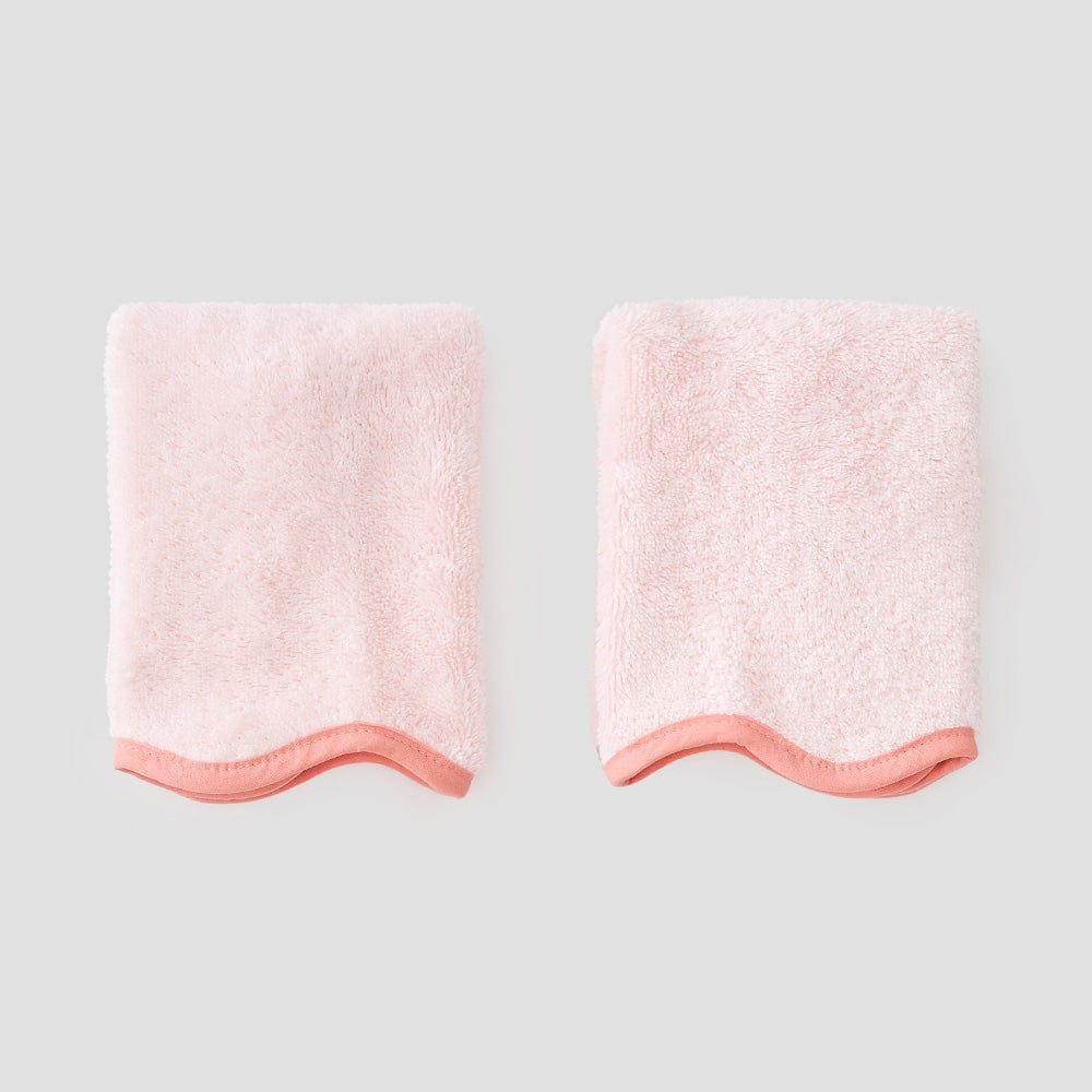 2 coral on ballet pink washcloths on grey background