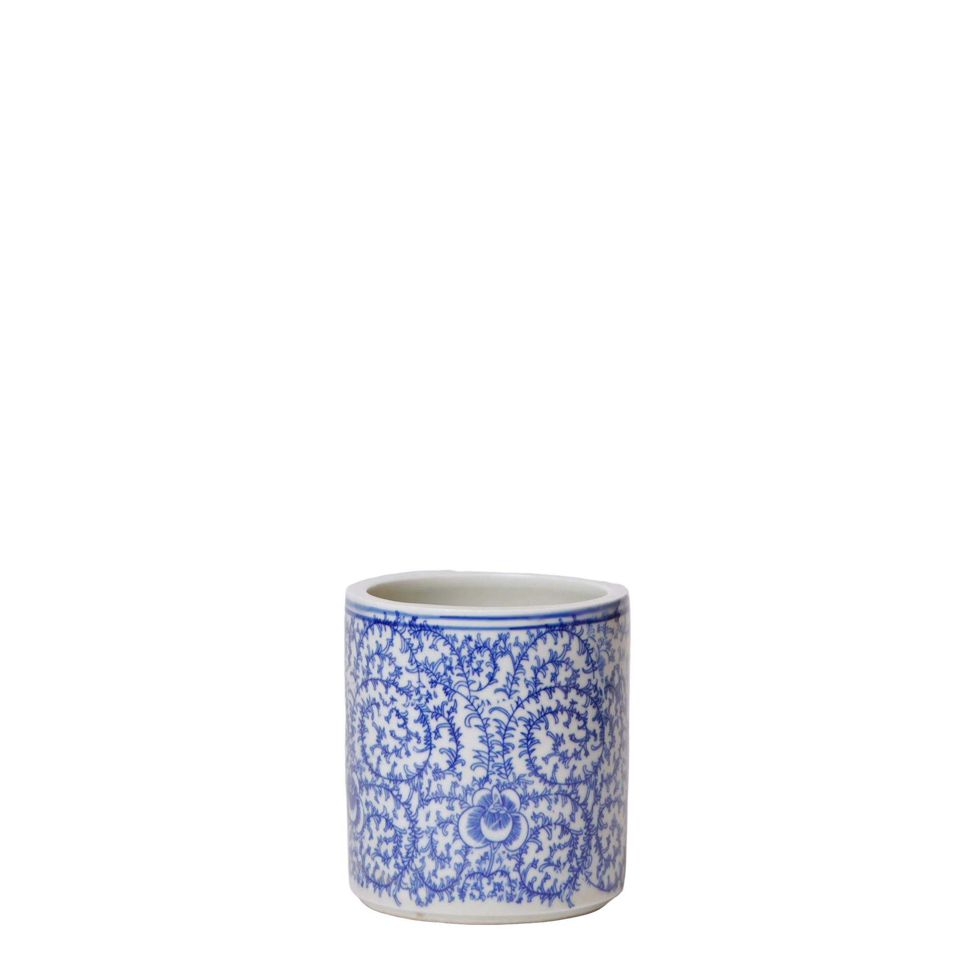 Ceramic mug with blue floral pattern on a white background