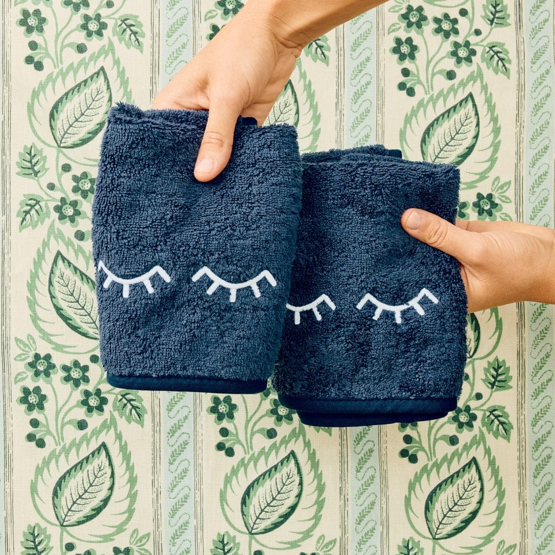 2 navy with eyelids makeup towels on floral background