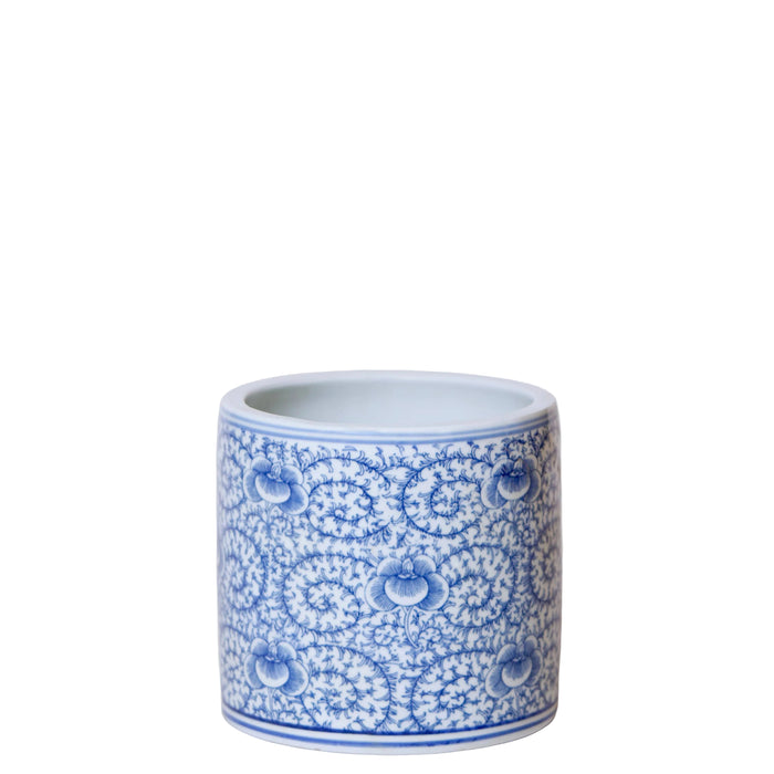 Blue and white ceramic container with intricate patterns on a white background