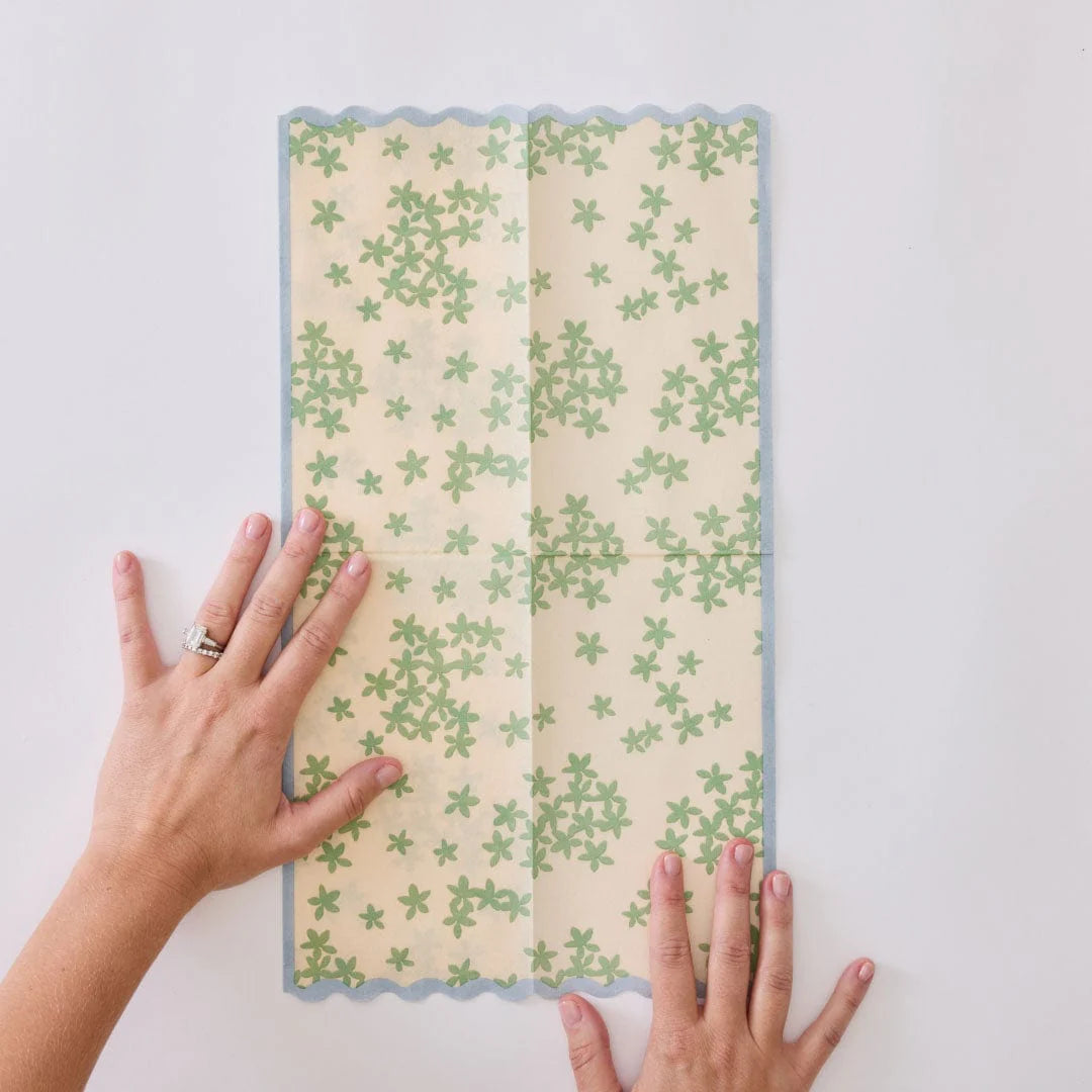 Unfolded paper napkin on grey background