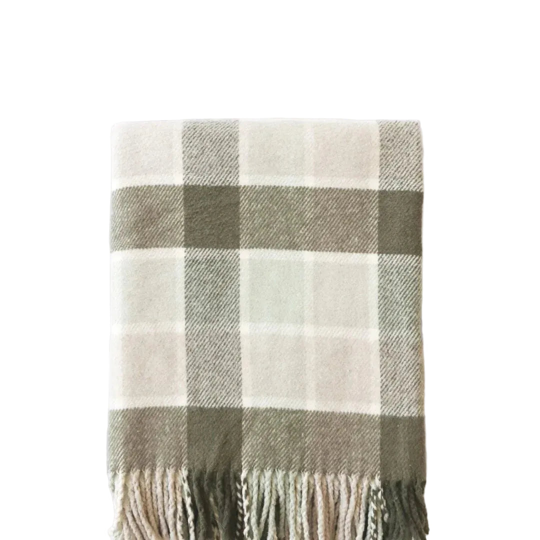 Plaid blanket with fringes on a white background