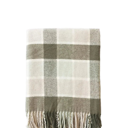 Plaid blanket with fringes on a white background