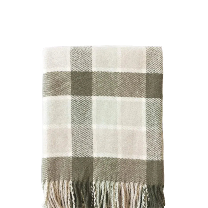 Plaid blanket with fringes on a white background