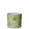 Ceramic pot with green floral pattern on a white background