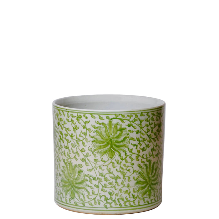 Ceramic pot with green floral pattern on a white background