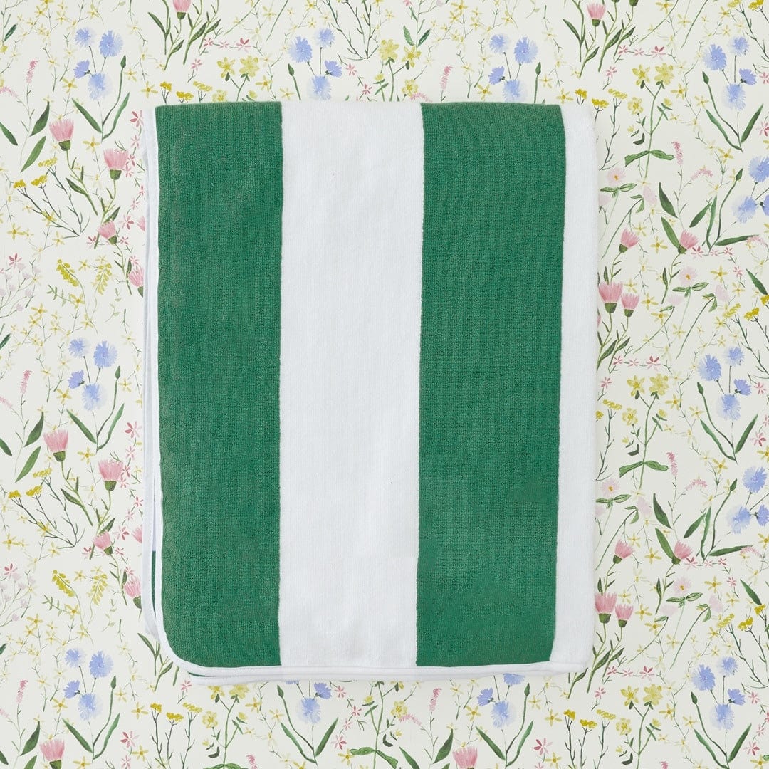 Green and white striped fabric on a floral background