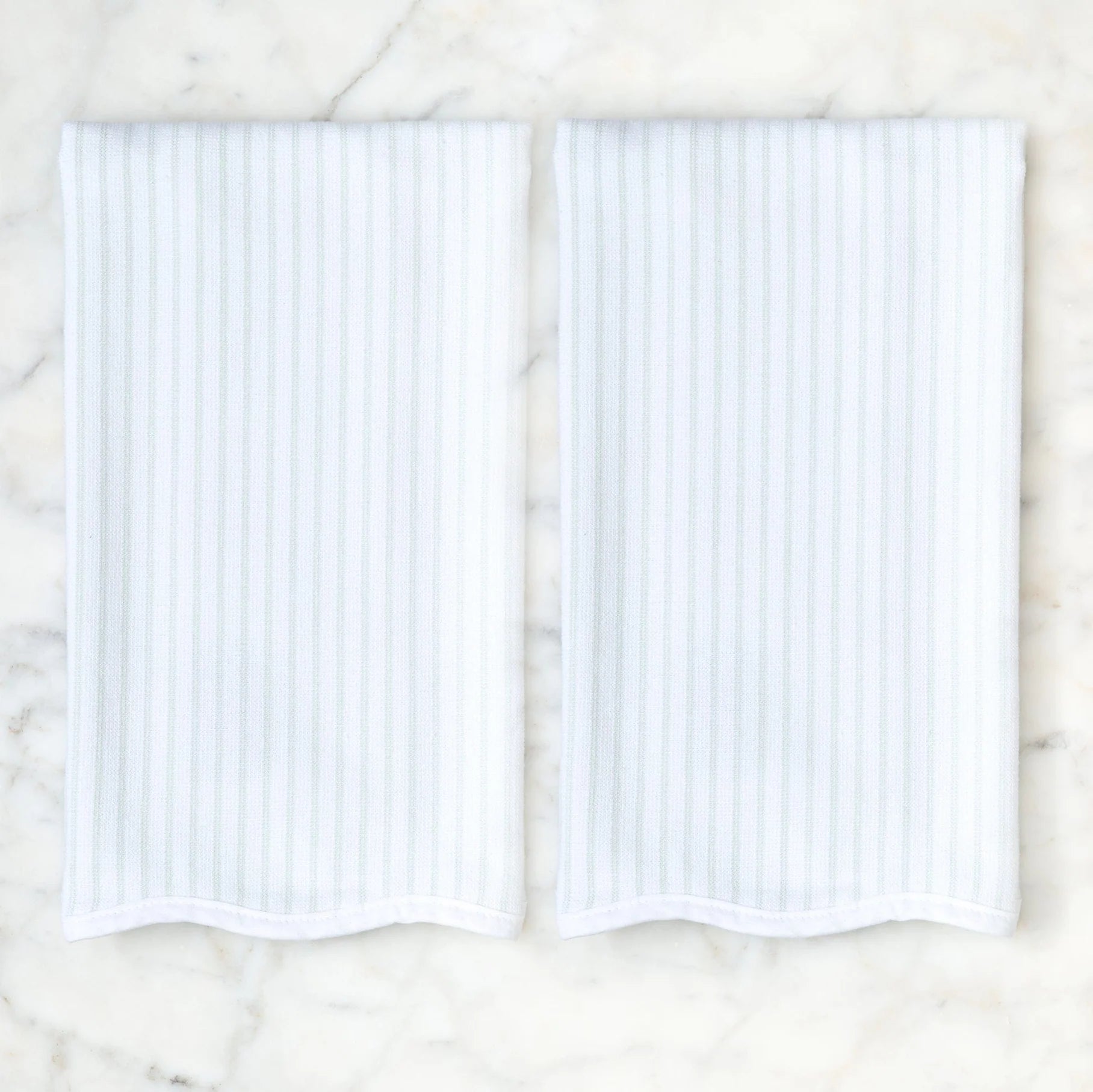 Set of 2 green pin stripe dish towels with scalloped edge on white background 