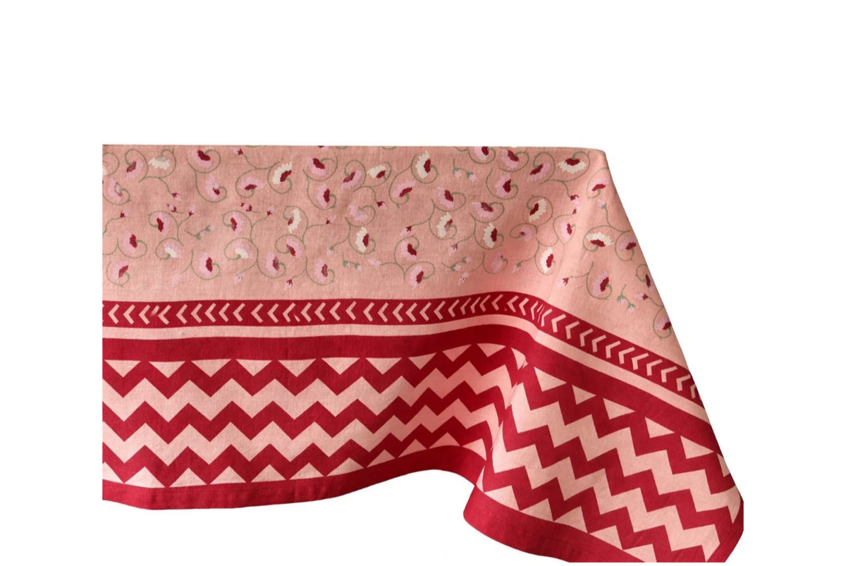 Tablecloth with flowers and zig zag bottom detail in reds and pinks
