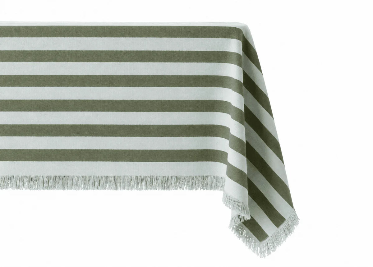 Striped green tablecloth with fringe edge on white background 