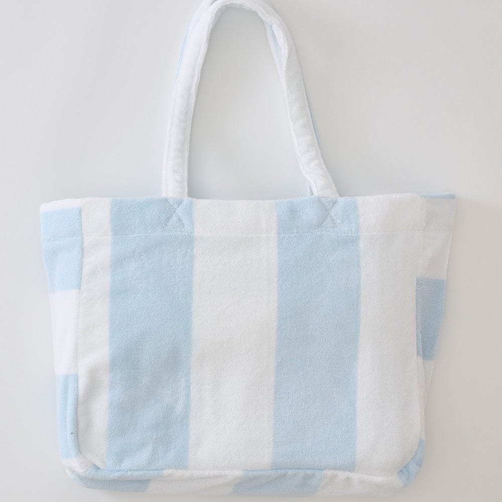 blue and white striped cotton beach bag on light grey background