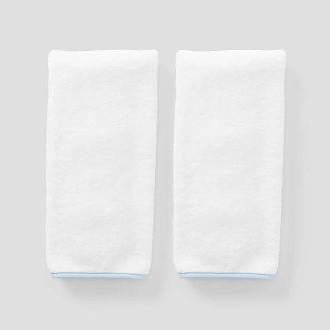 2 light blue on white signature towels on grey background