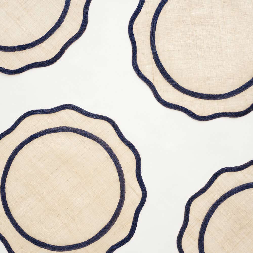 Set of 4 Natural Fiber Navy Scalloped Edge Placemats on white background