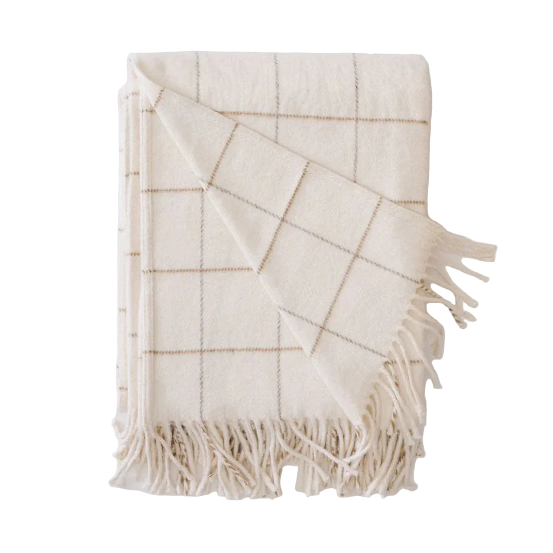Beige plaid blanket with fringes on a white background