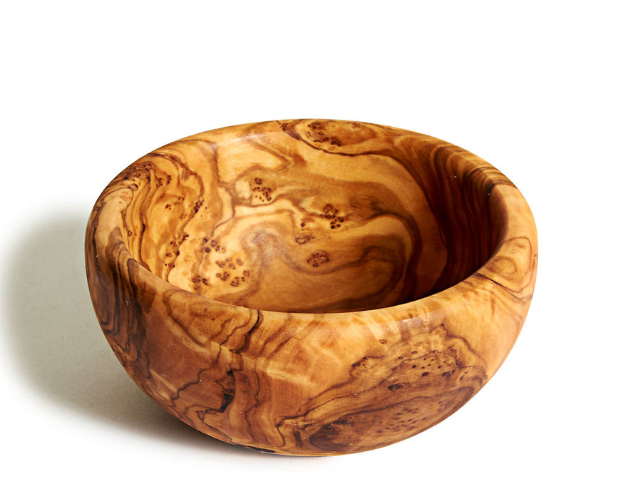 Wooden bowl with natural grain pattern on a white background