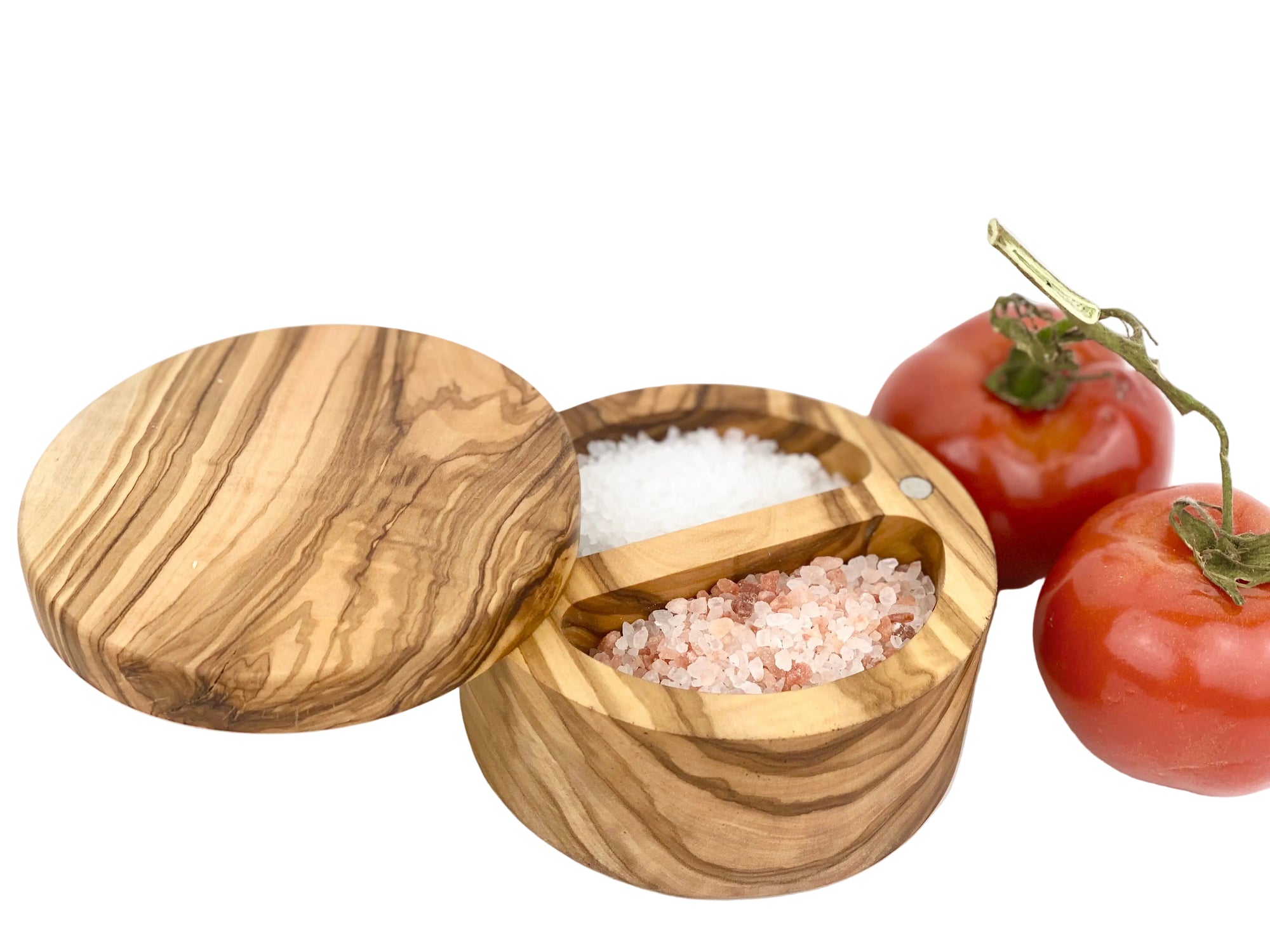 Wooden salt and pepper shakers with tomatoes on a white background