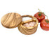 Wooden salt and pepper shakers with tomatoes on a white background