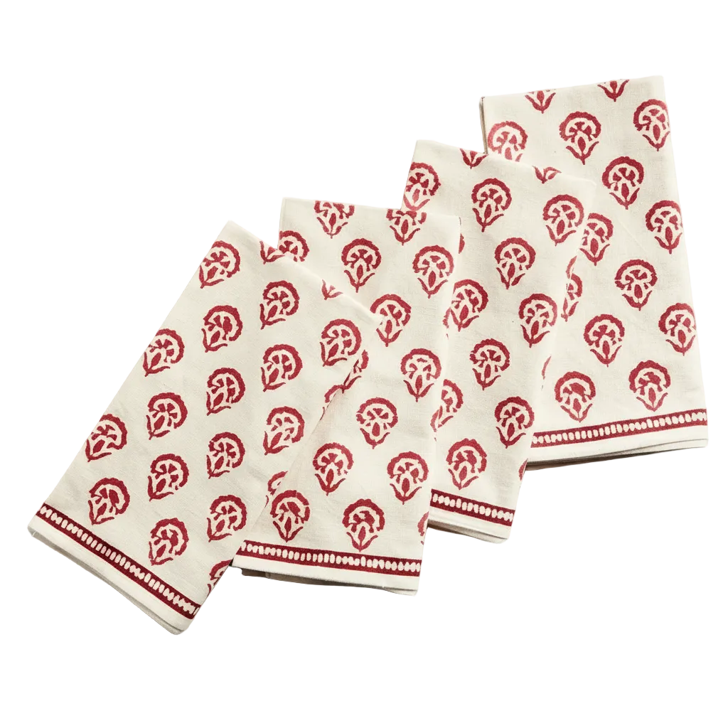 Set of red kitchen towels with red pattern on a gray surface