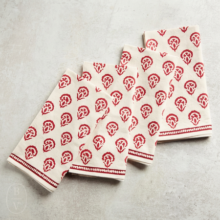 Set of red kitchen towels with red pattern on a gray surface