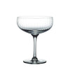Clear glass cocktail bowl on a white background