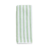 Striped towel with green and white stripes on a light gray background