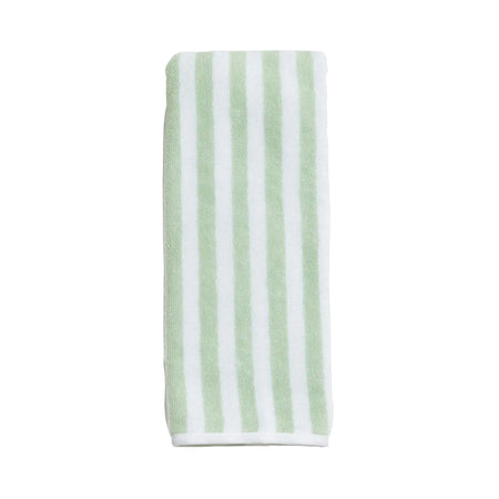 Striped towel with green and white stripes on a light gray background