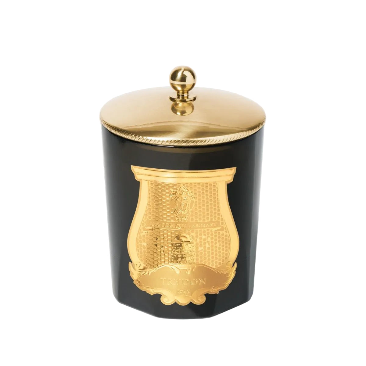 Black container with gold lid and decorative emblem on a light gray background
