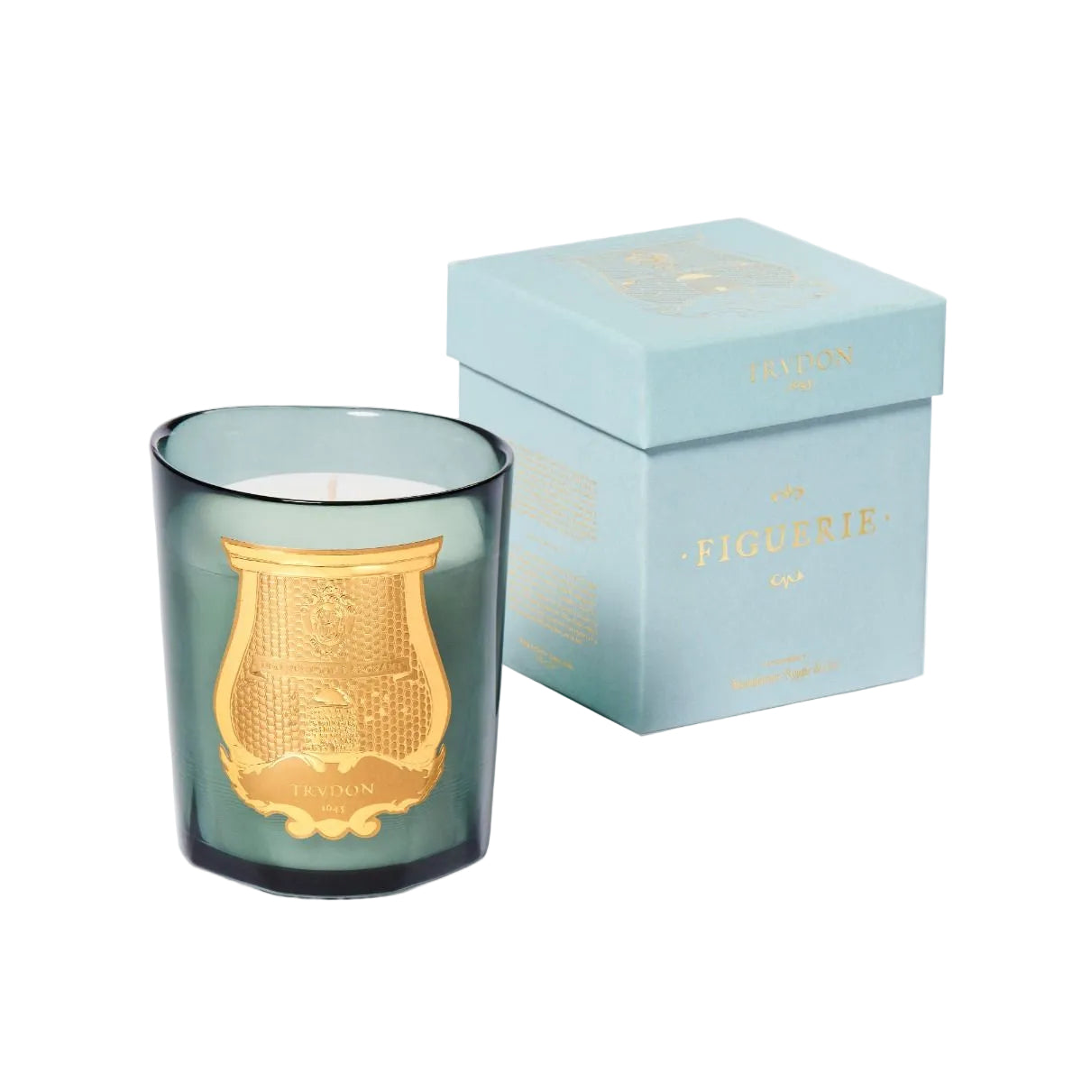 Green candle with gold emblem and matching box on a light gray background