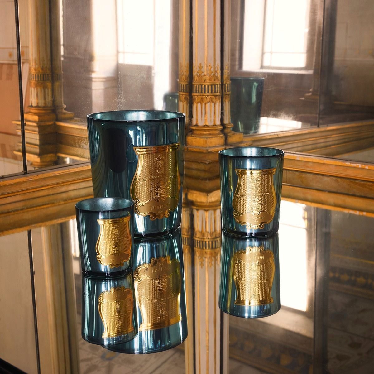 Trudon Fir Christmas tree scented candles in celadon mirror-finish glass with gold emblem labels