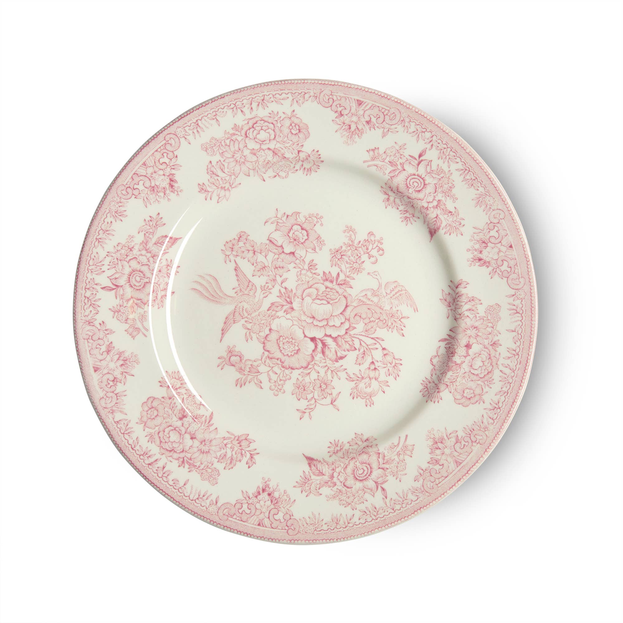 A medium-sized earthenware plate with a pink floral pattern on a white background.
