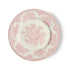 A medium-sized earthenware plate with a pink floral pattern on a white background.