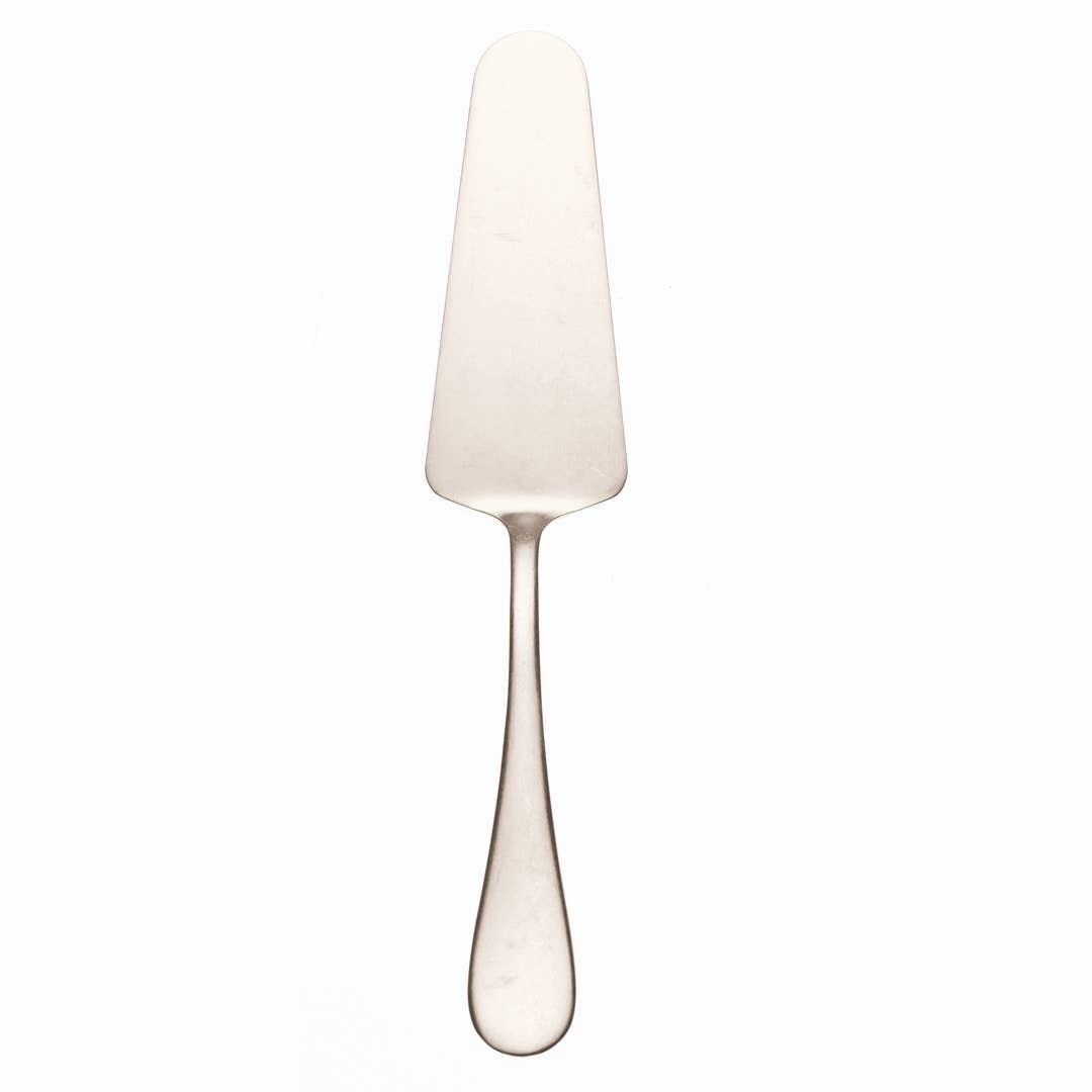 Cake server in vintage champagne on white background 