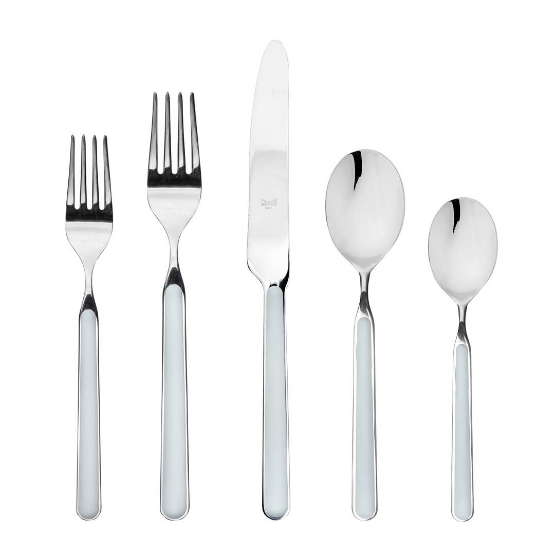 Five piece Italian flatware set in light blue with 2 forks, knife and 2 spoons on white background 