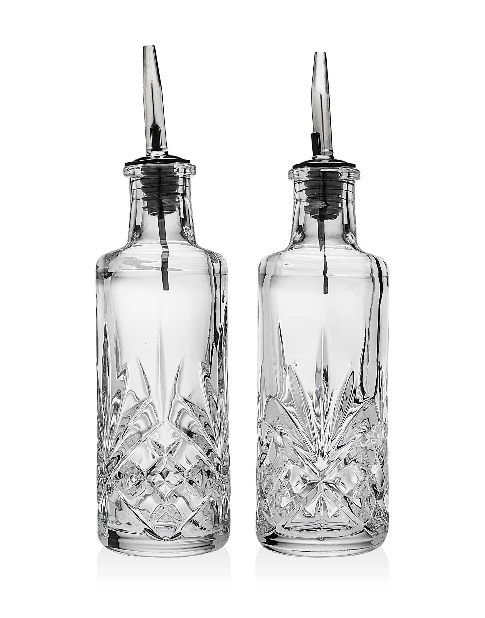 Crystal set of oil and vinegar bottles with stainless steel pour top on white background 